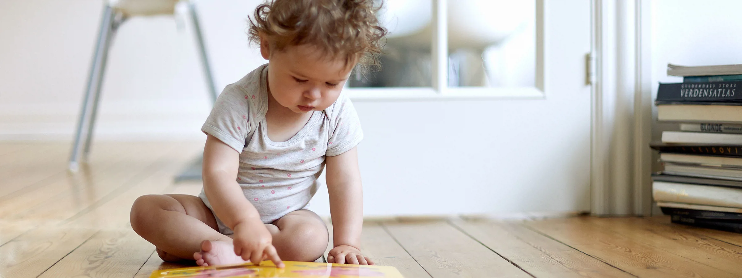 Baby looking in a book